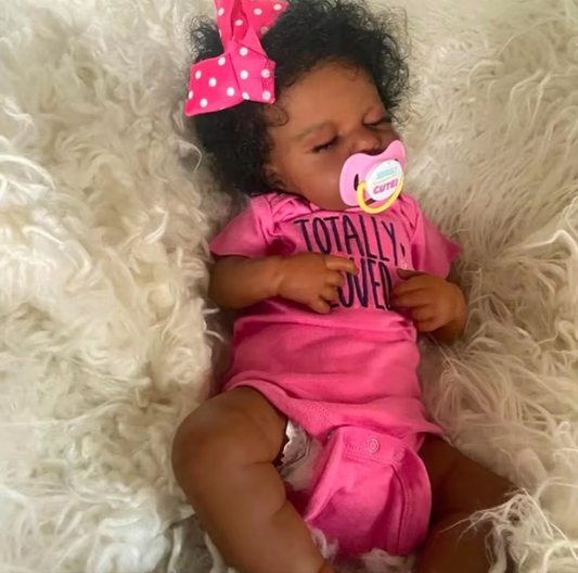 Realistic soft-touch newborn baby doll with lifelike facial features, wearing baby clothes – ideal for imaginative and nurturing play for children.